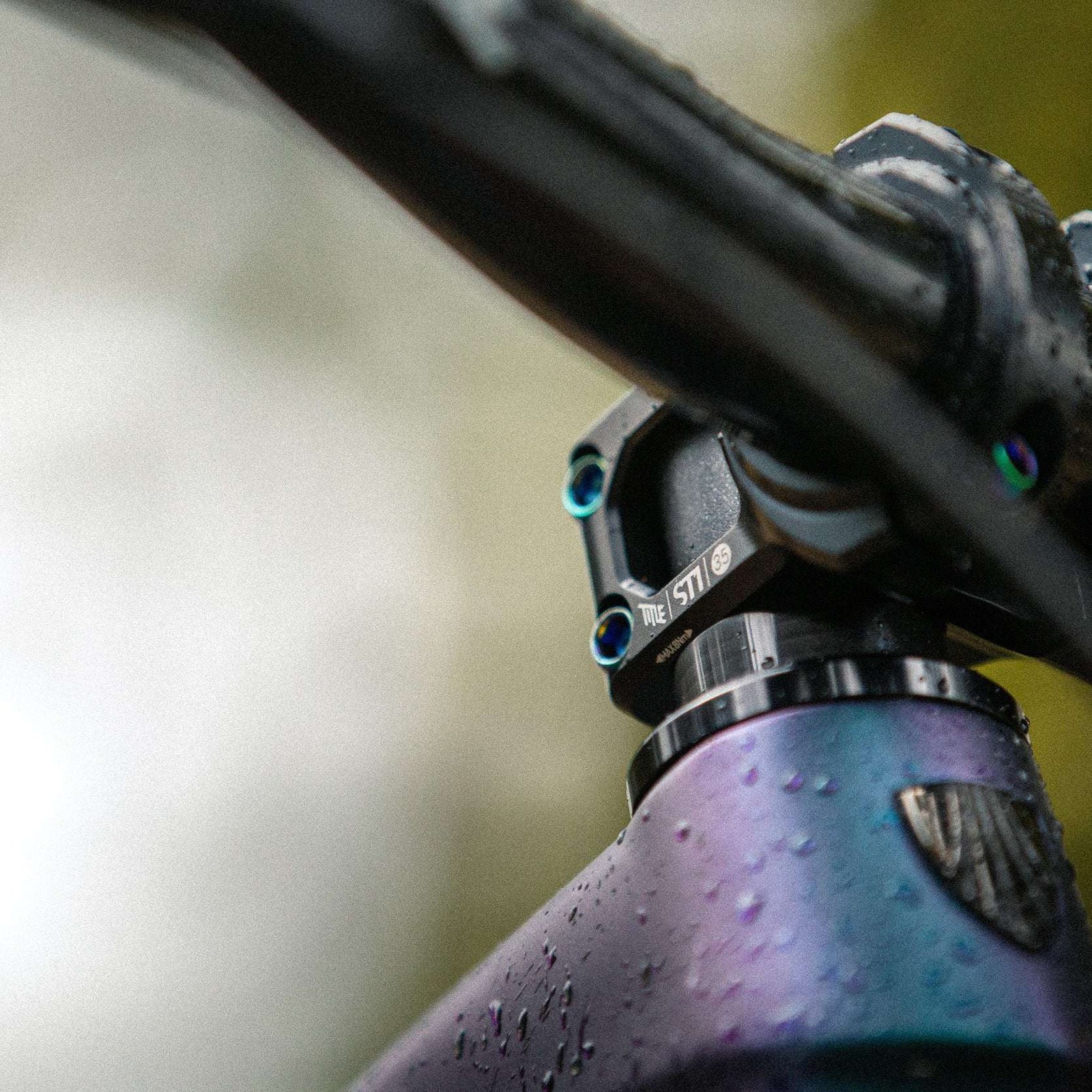 ST1 35mm clamp - Title MTB oil slick rainbow bolts mounted on bike Casey Brown